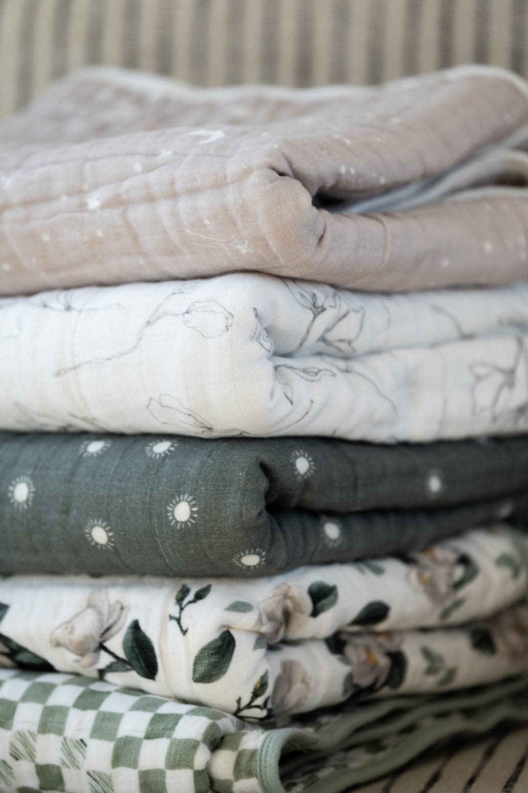 Baby wrapped in organic muslin quilt